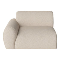 Beige textured lounge chair with soft curves and a minimalist design. Perfect for modern interior decor.