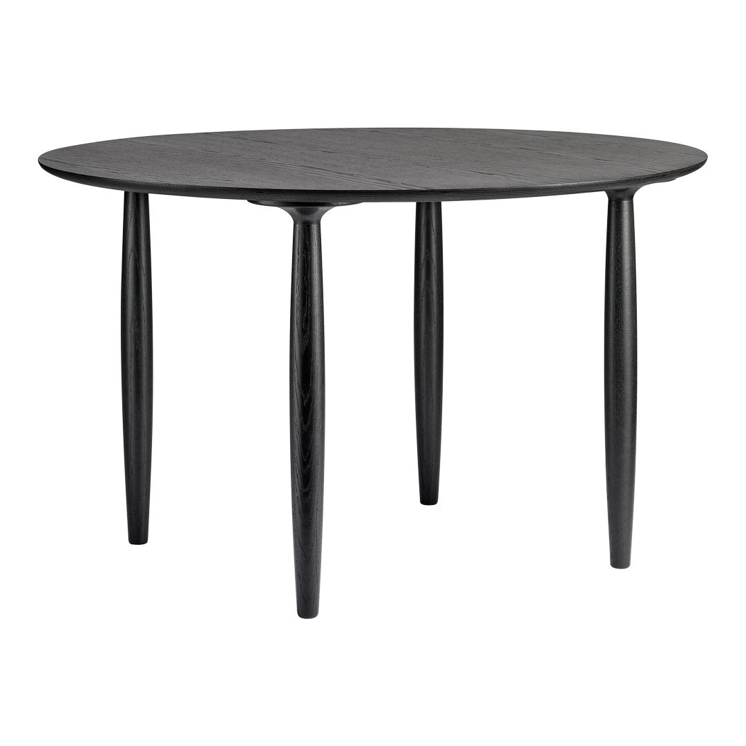 Round black dining table with a smooth finish and sleek, tapered legs. Modern minimalist design for any space.