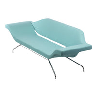 Teal modern sofa with a sleek, minimalist design and smooth contours, complemented by chrome legs.