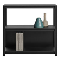 Black shelving unit with clean lines, featuring light beige and teal ceramic vases and stacked white books.