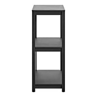 Slim black shelving unit with a minimalist design and smooth surfaces, perfect for modern decor and organization.
