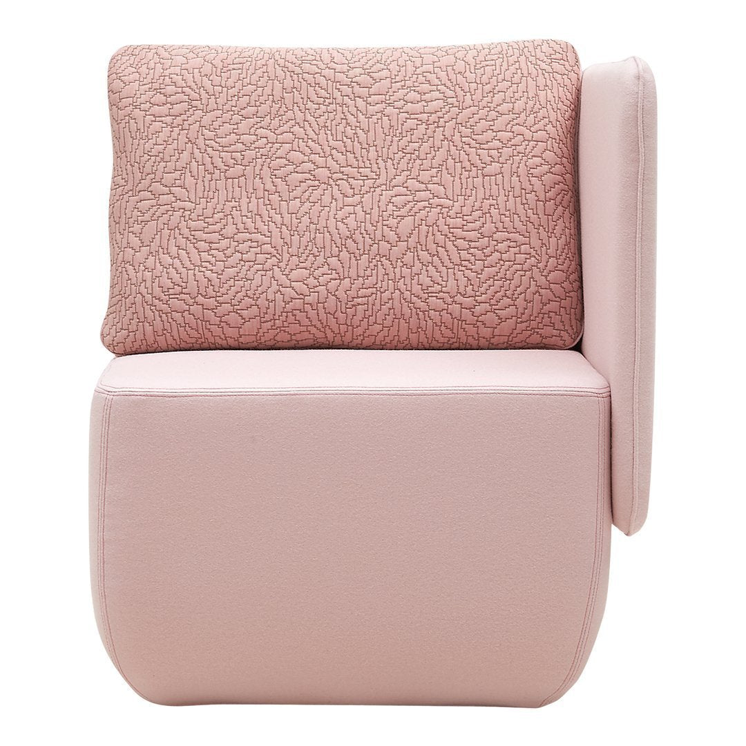Pink upholstered chair with textured cream pattern on back cushion, featuring a minimalist design.
