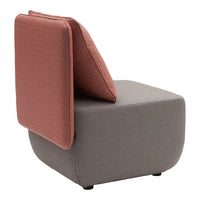 Modern gray chair with a textured, coral pink back cushion, highlighting contemporary design and color contrast.