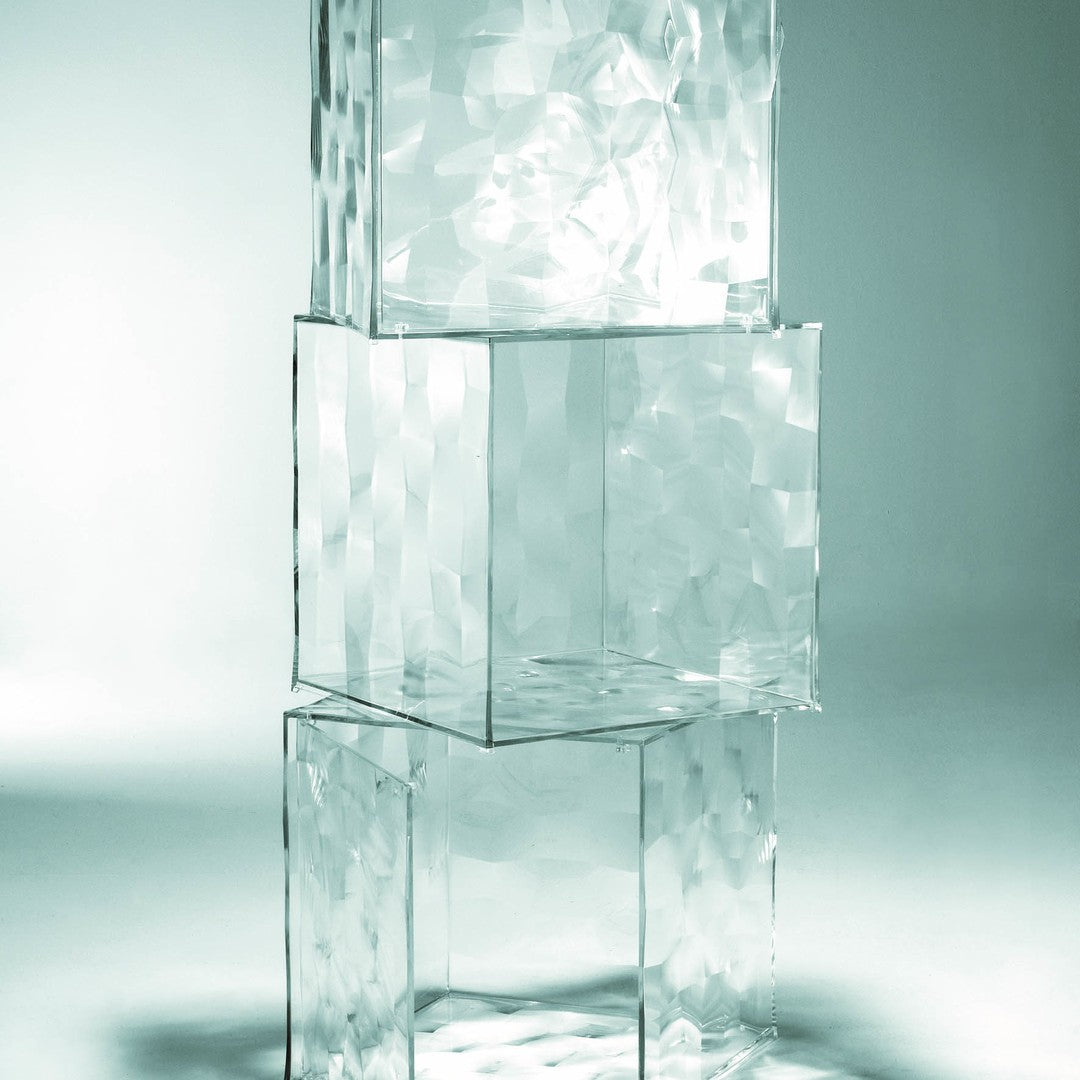Transparent glass cubes with textured surfaces, reflecting light and creating subtle patterns. Ideal for modern decor.