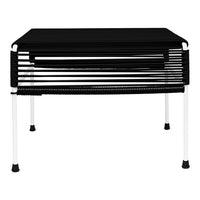 Black striped table with white legs, featuring a modern and sleek design, perfect for contemporary decor.