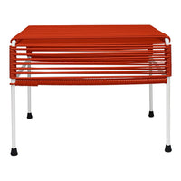 Red slatted design table with white legs, perfect for modern outdoor or indoor decor.