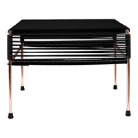 Black striped table with copper legs, featuring a modern design and sleek finish for contemporary decor.