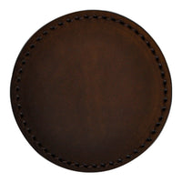 Round brown leather coaster with a smooth surface and intricate stitched border pattern. Ideal for home decor.