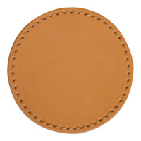 Tan leather round coaster with a stitched edge, showcasing a smooth and minimalist design.