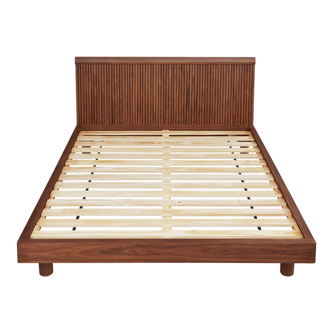 Wooden bed frame in rich brown with vertical slatted headboard and a light wooden slat base, showcasing a natural finish.