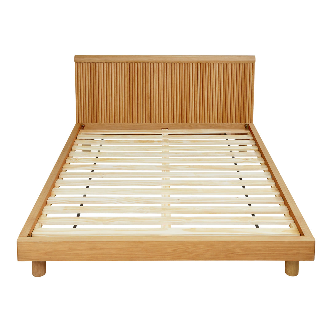 Natural wood bed frame with a horizontal slatted headboard in light oak finish, showcasing a minimalist design.
