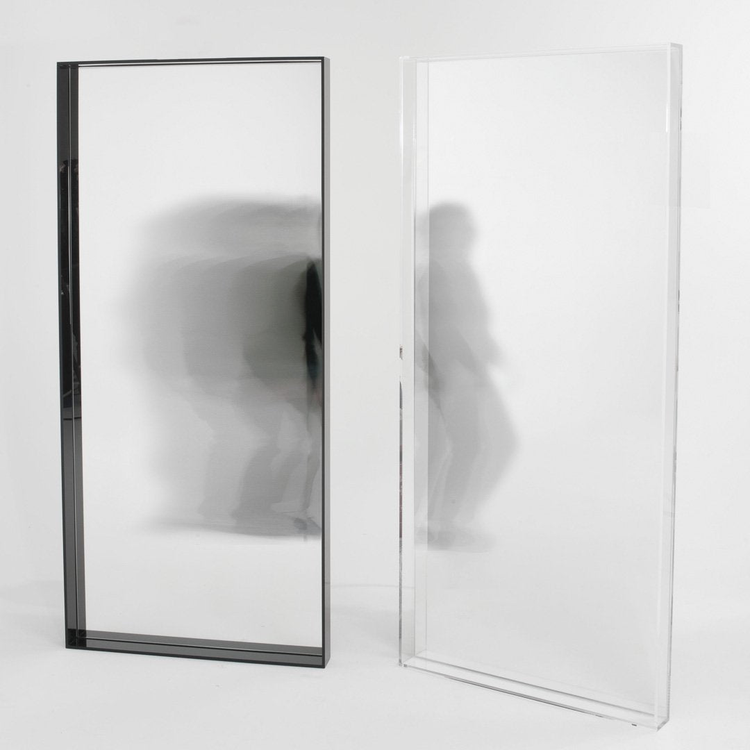 "Modern black and clear glass mirrors with sleek, minimalist design, showcasing reflective surfaces and subtle patterns."