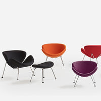 Colorful modern chairs in black, orange, red, and purple with sleek metal legs and curved designs. Perfect for any space.