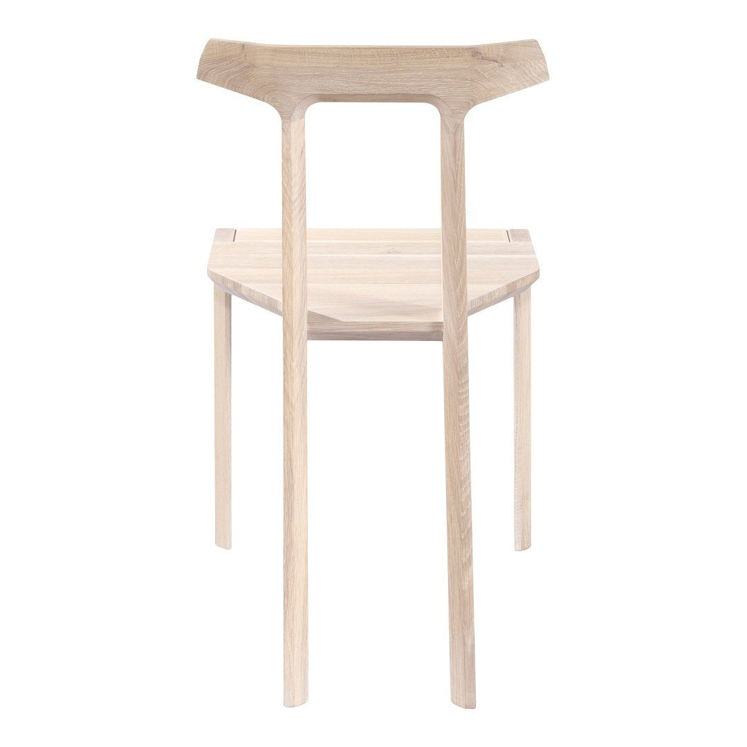 Natural wood chair with a minimalist design, featuring a light, smooth finish and clean, simple lines.