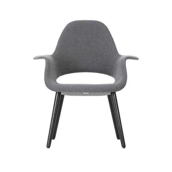 Gray fabric armchair with black wooden legs, featuring a smooth, minimalist design and seamless contours.