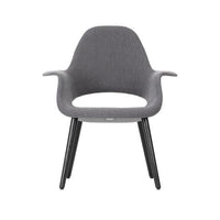 Gray fabric armchair with black wooden legs, featuring a smooth, minimalist design and seamless contours.