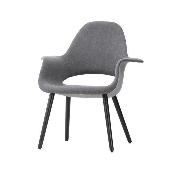 Gray upholstered chair with a smooth, modern design and black wooden legs, perfectly suited for contemporary interiors.