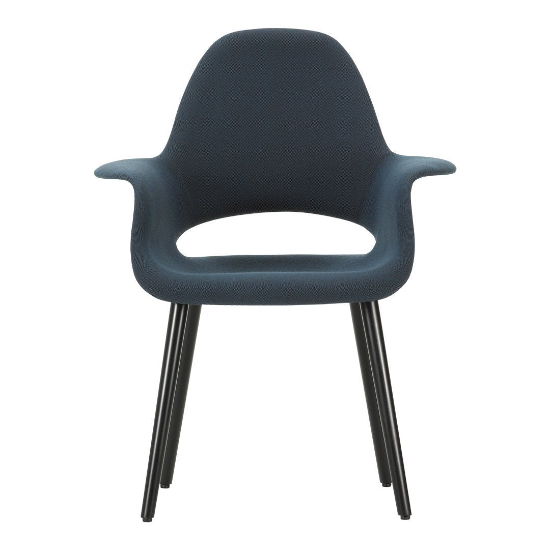 Modern dark blue chair with smooth curves and black tapered legs, perfect for contemporary decor.