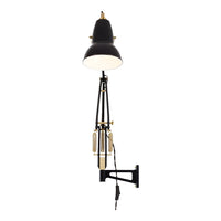 Stylish black wall lamp with gold accents; sleek design perfect for modern decor.