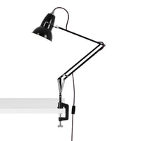 Black industrial desk lamp with adjustable arm and clamp, featuring a minimalist design against a white background.