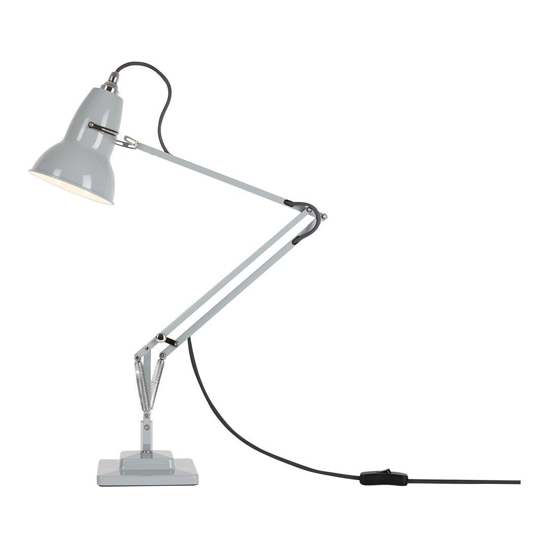 Gray adjustable desk lamp with silver accents and a sleek modern design. Perfect for stylish office lighting.