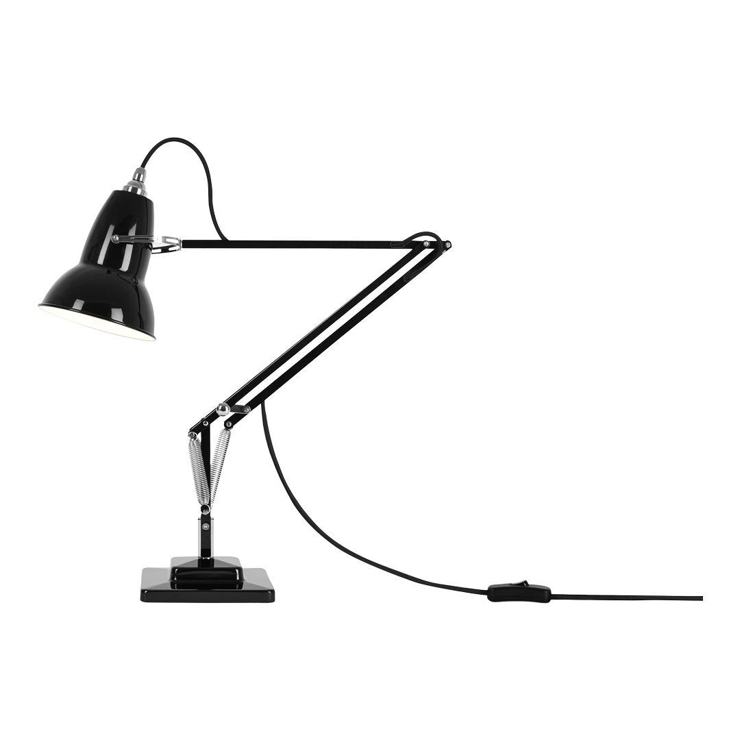 Black adjustable desk lamp with a sleek, minimalist design and chrome accents on the arm and base.