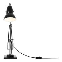 Black metal desk lamp with a sleek, modern design and a white lampshade, featuring simple geometric patterns.