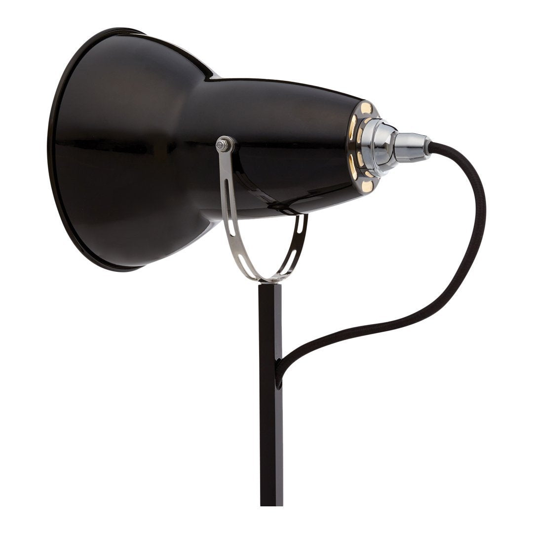 Black metal lamp with chrome accents and a sleek design, featuring a matte finish and minimalistic details.