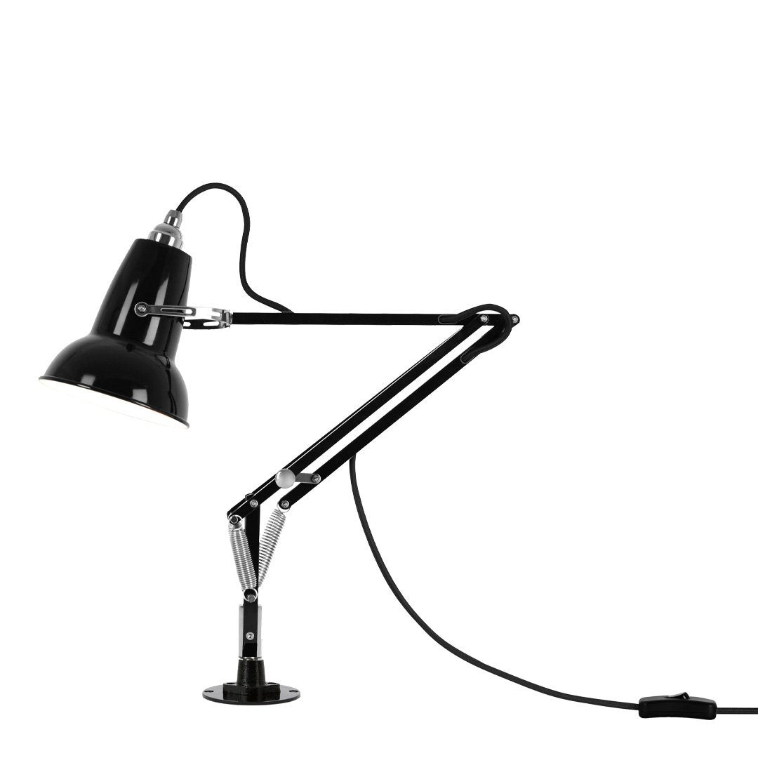 Black desk lamp with a sleek, modern design and chrome accents, featuring a flexible arm for adjustable lighting.