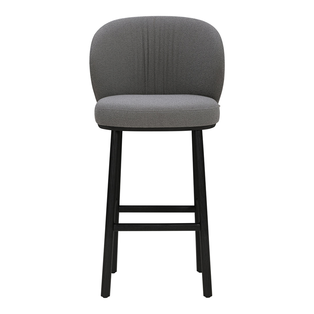 Gray upholstered bar stool with ribbed pattern and sleek black wooden legs. Modern and stylish home decor.