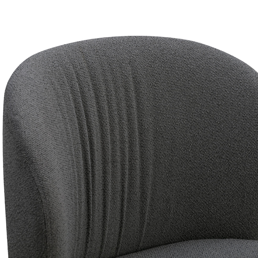 Gray upholstered chair with subtle ribbed texture, perfect for modern interiors.