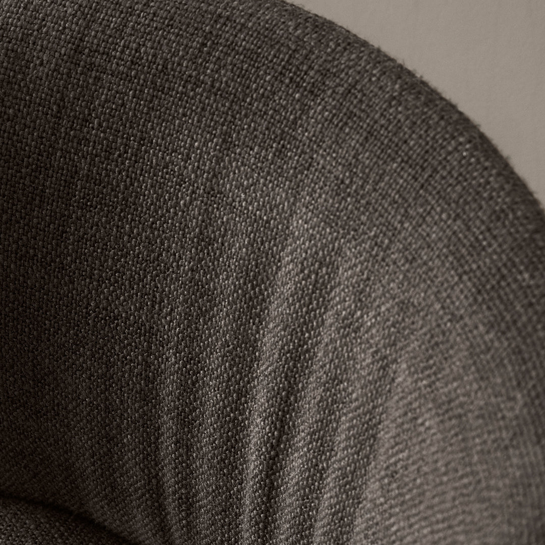 Textured gray fabric with subtle woven patterns, showcasing a modern, sophisticated design ideal for contemporary interiors.
