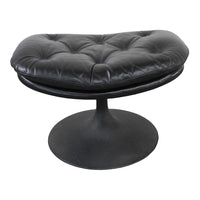 Black tufted leather ottoman with a sleek round base, featuring a modern design and soft, smooth texture.