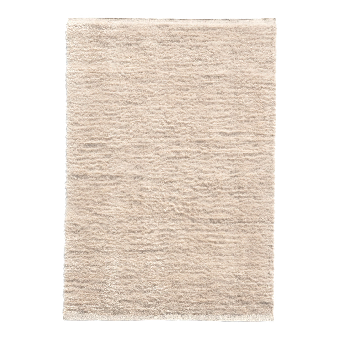 Textured beige rug with subtle tonal variations and a soft, woven pattern. Ideal for neutral-themed decor.