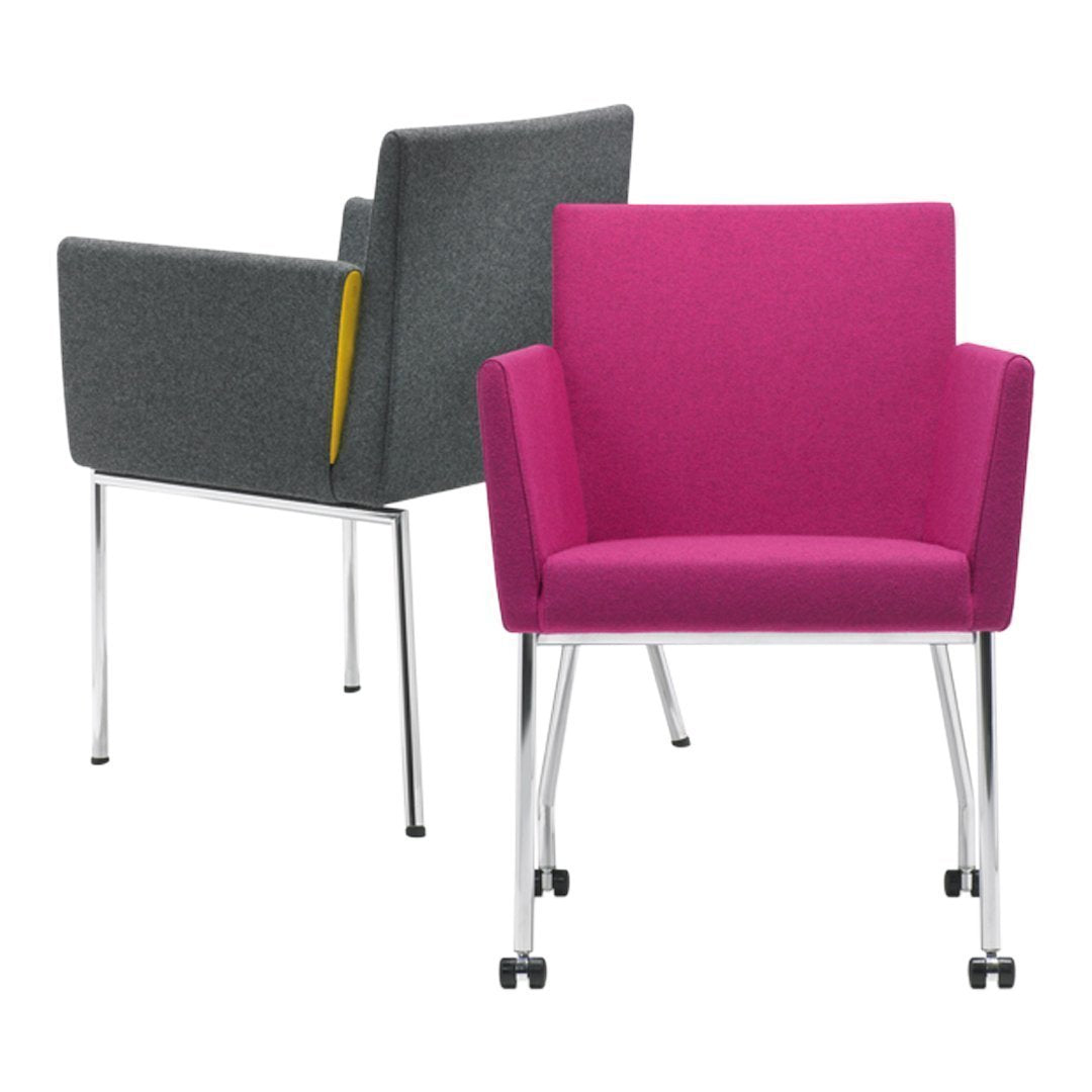 Modern chairs featuring a vibrant pink and a sleek gray fabric, both with clean lines and chrome legs.