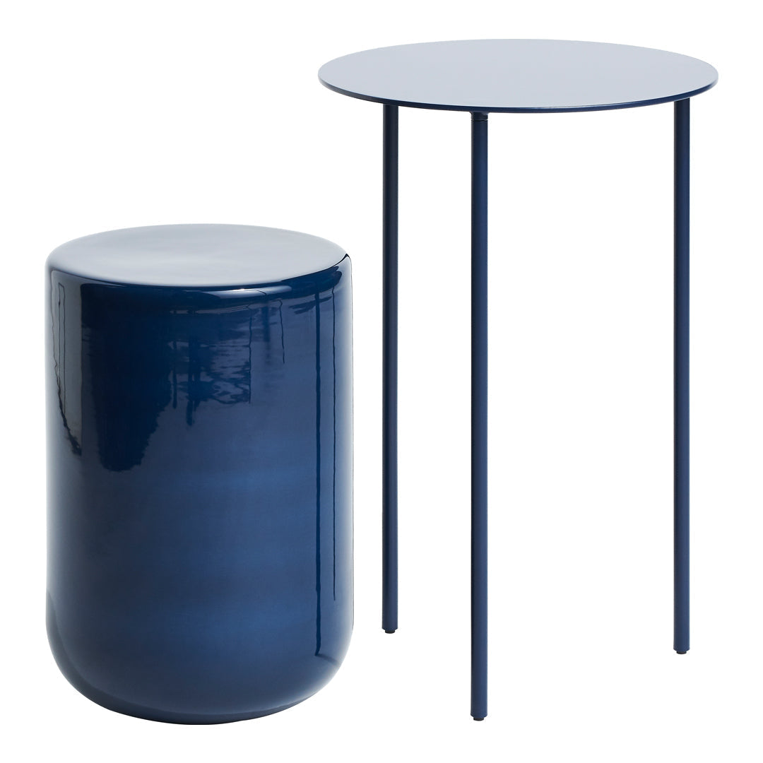 "Modern navy blue side table set featuring a round top and a cylindrical accent piece."