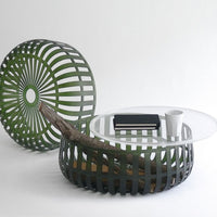 Green striped coffee table and decorative stool with a modern design and natural wooden accents.