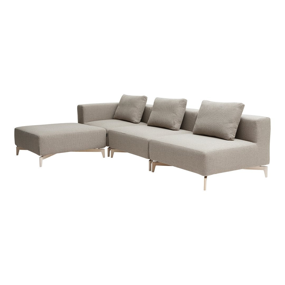 Beige modular sofa with clean lines and subtle texture, featuring three cushions and sleek metal legs.