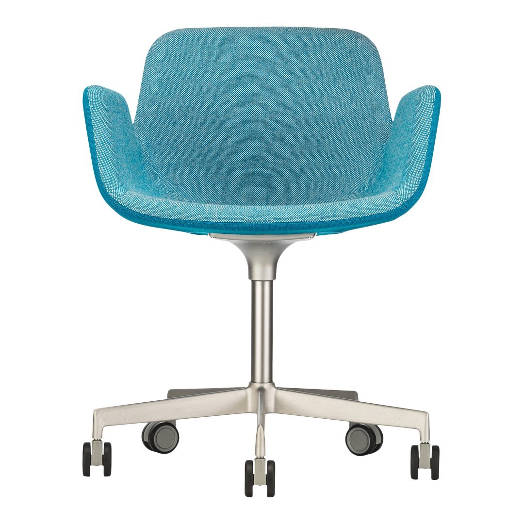 "Teal upholstered chair with smooth, curved lines and a sleek metal base, featuring a minimalist design."
