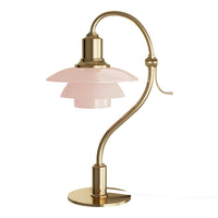 Elegant pink glass shade lamp with a sleek gold metal base and curved design, perfect for modern decor.