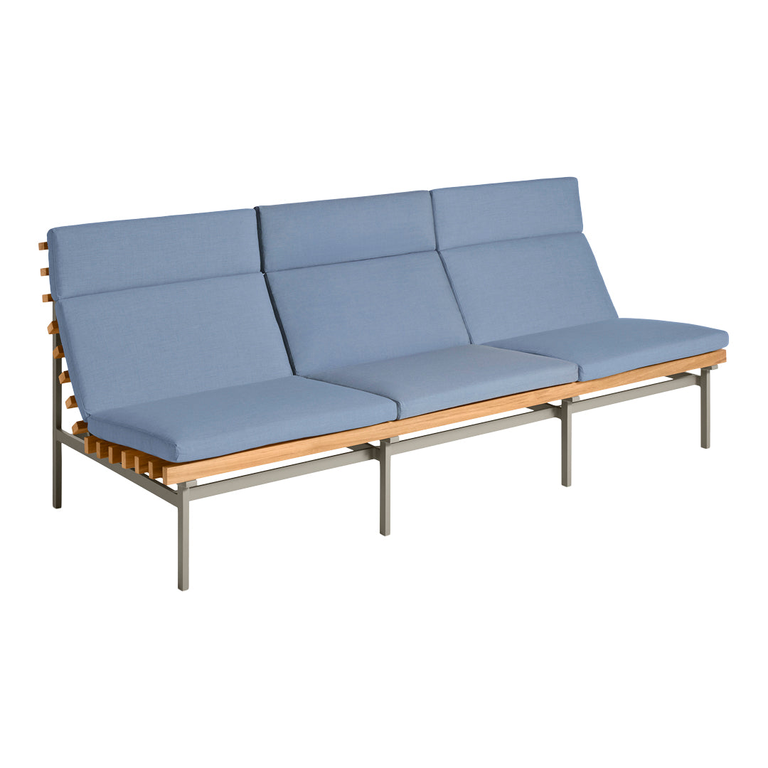 Stylish mid-century modern sofa in light blue fabric with natural wood and metal accents.