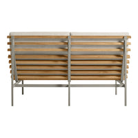 Back view of a modern bench featuring a natural wood slatted design and a sleek metal frame in neutral tones.