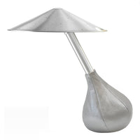 Sleek silver lamp with a modern conical shade and teardrop base, showcasing a minimalist design and smooth textures.