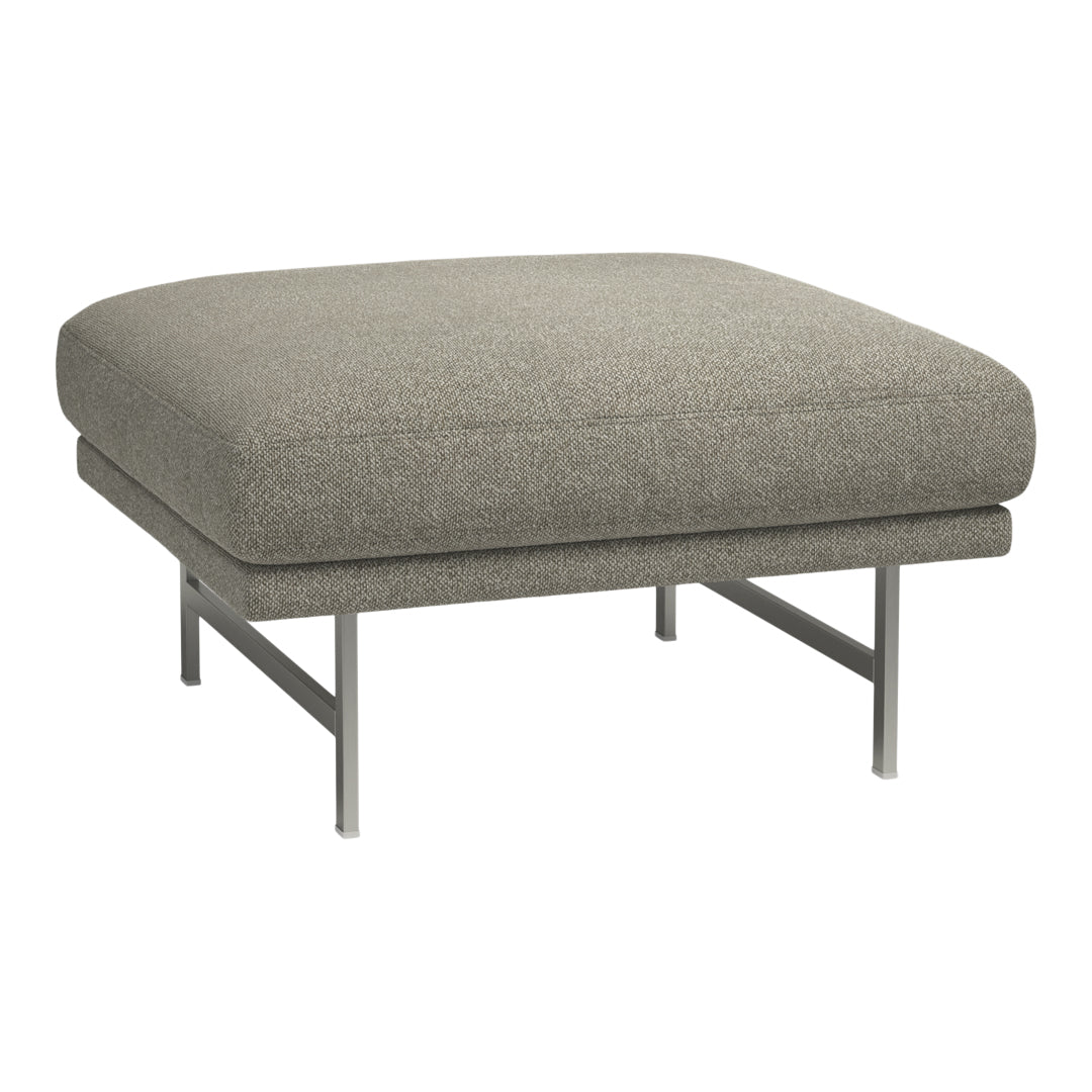 Gray upholstered ottoman with a smooth texture and sleek silver metal legs. Modern and minimalist design.