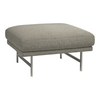 Gray upholstered ottoman with a smooth texture and sleek silver metal legs. Modern and minimalist design.