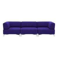 Vibrant purple modular sofa with a smooth, solid fabric design, perfect for modern living spaces.