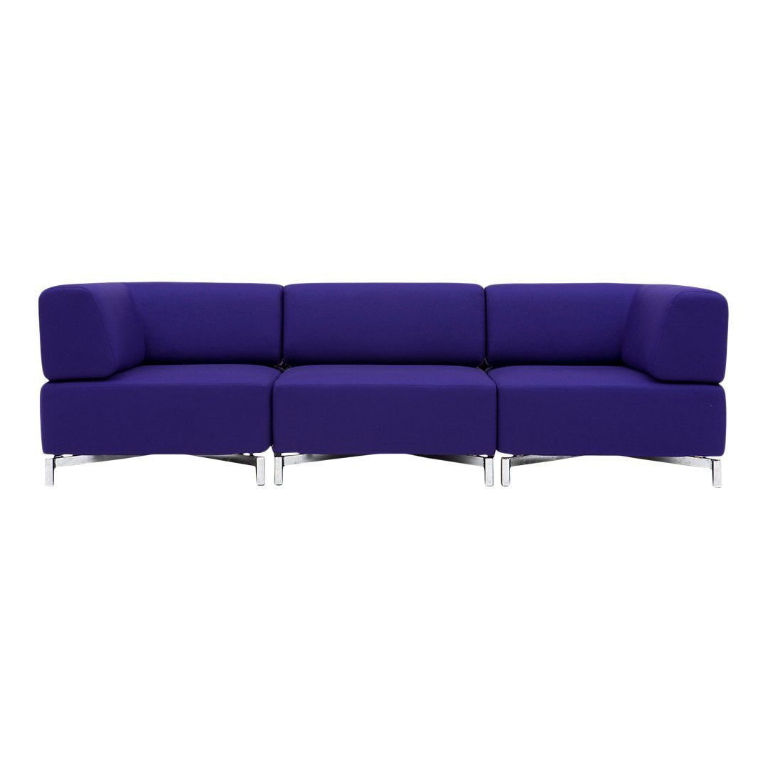 Vibrant purple modular sofa with a sleek, modern design and smooth fabric upholstery. Perfect for contemporary spaces.
