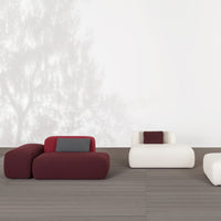 Modern seating with burgundy and cream colors, featuring smooth, rounded shapes and subtle gray accents.