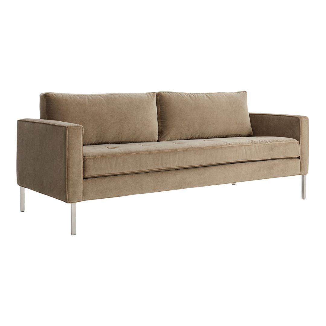 Beige sofa with a sleek, minimalist design and subtle texture on a silver metal frame. Perfect for modern decor.