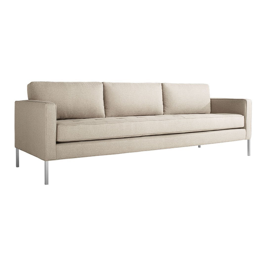 Beige fabric sofa with clean lines and three plush cushions, featuring a minimalist design and sleek metal legs.